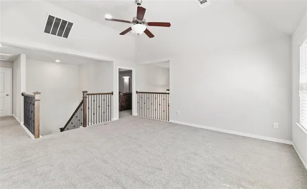 a bedroom with a bed and a desk