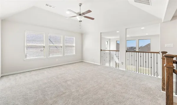 a room with a window and a ceiling fan