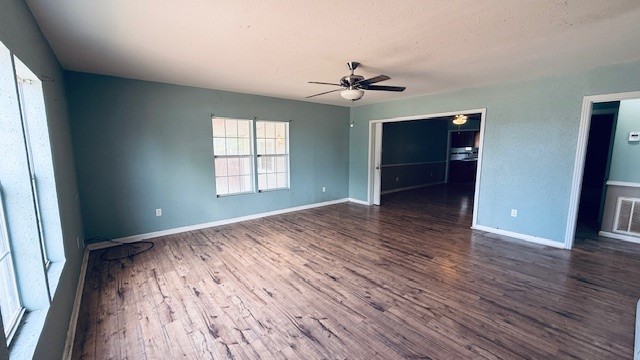 305 East Milam Street Pettus, TX 78416 - Photo 13 of 21 wooden floor in an empty room with a window