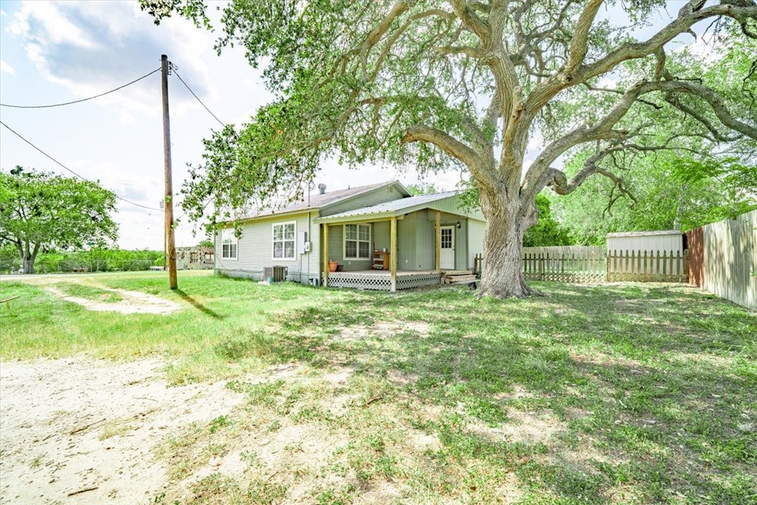 305 East Milam Street Pettus, TX 78416 - Photo 19 of 21 a view of a house with yard and sitting area