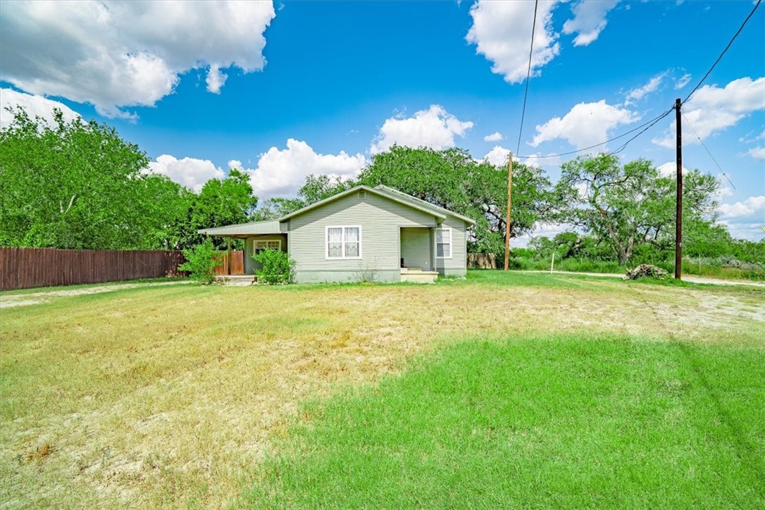 305 East Milam Street Pettus, TX 78416 - Photo 2 of 21 a front view of house with yard and green space