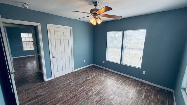305 East Milam Street Pettus, TX 78416 - Photo 5 of 21 a view of room with window ceiling fan and hardwood floor
