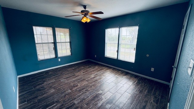 305 East Milam Street Pettus, TX 78416 - Photo 8 of 21 an empty room with windows and ceiling fan