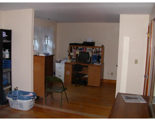 46 Hawthorne Road Ashland, MA 01721 - Photo 3 of 8 a kitchen with a refrigerator and cabinets