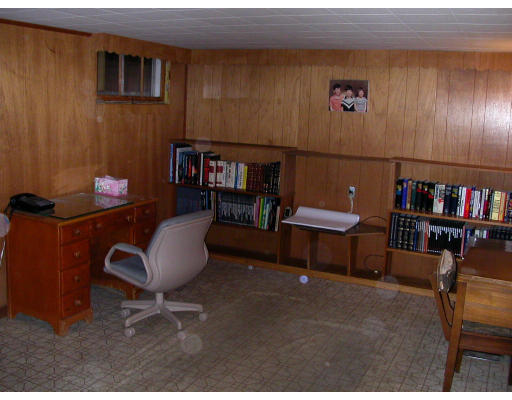 46 Hawthorne Road Ashland, MA 01721 - Photo 5 of 8 a living room with furniture and a bookshelf