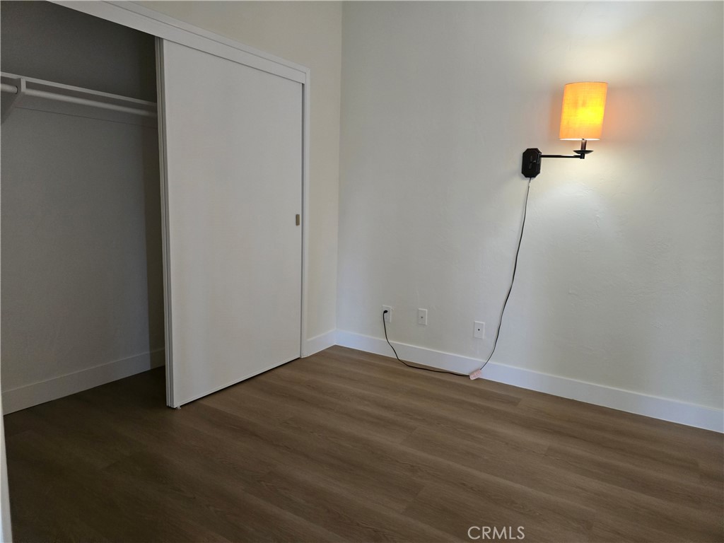 1350 West Lambert Road La Habra, CA 90631 - Photo 2 of 7 a view of an empty room with wooden floor