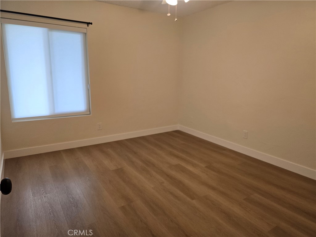 1350 West Lambert Road La Habra, CA 90631 - Photo 5 of 7 a view of a small space with wooden floor and a window