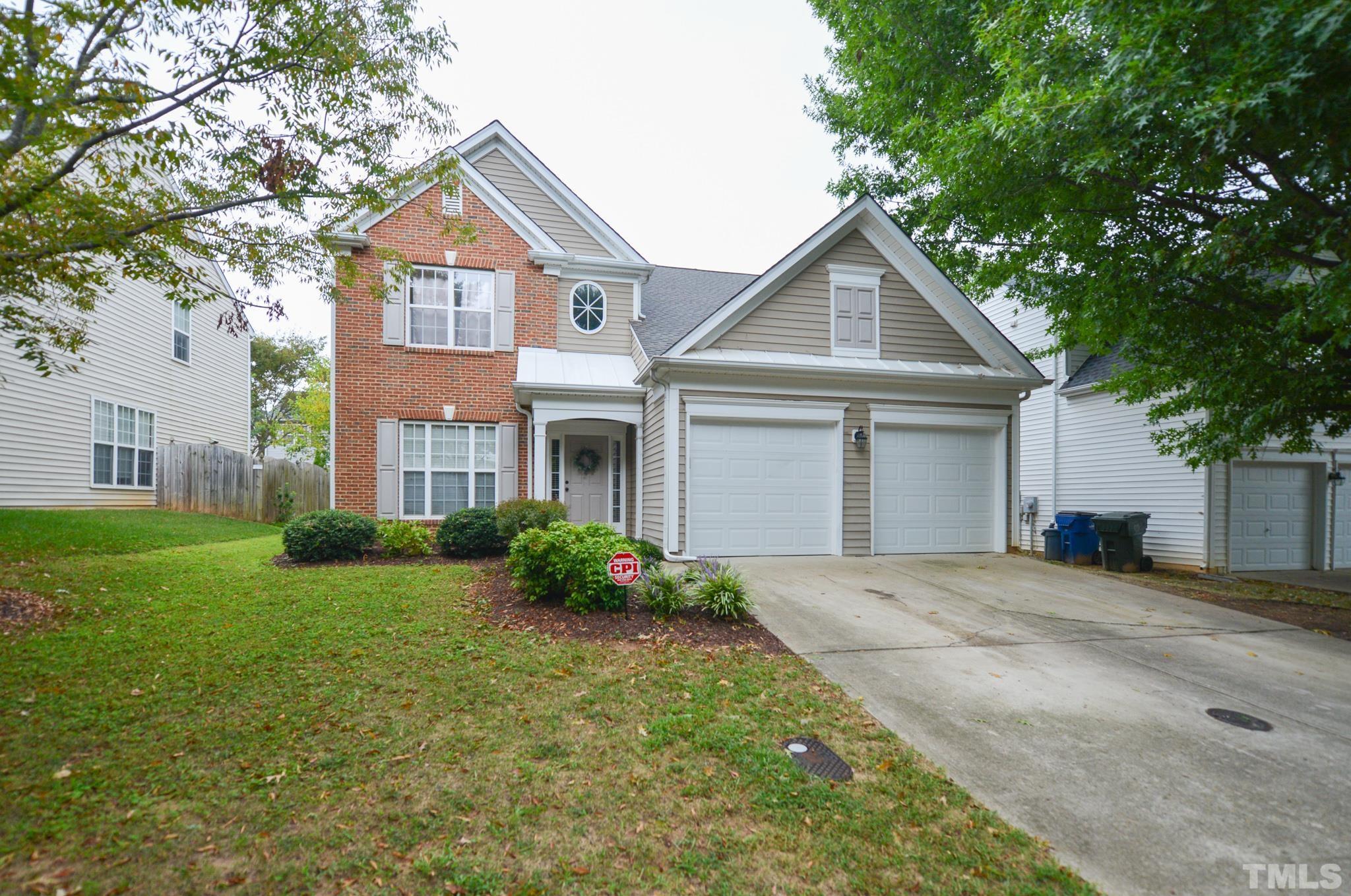 1513 Nealstone Way Raleigh, NC 27614 - Photo 2 of 30 a front view of a house with garden