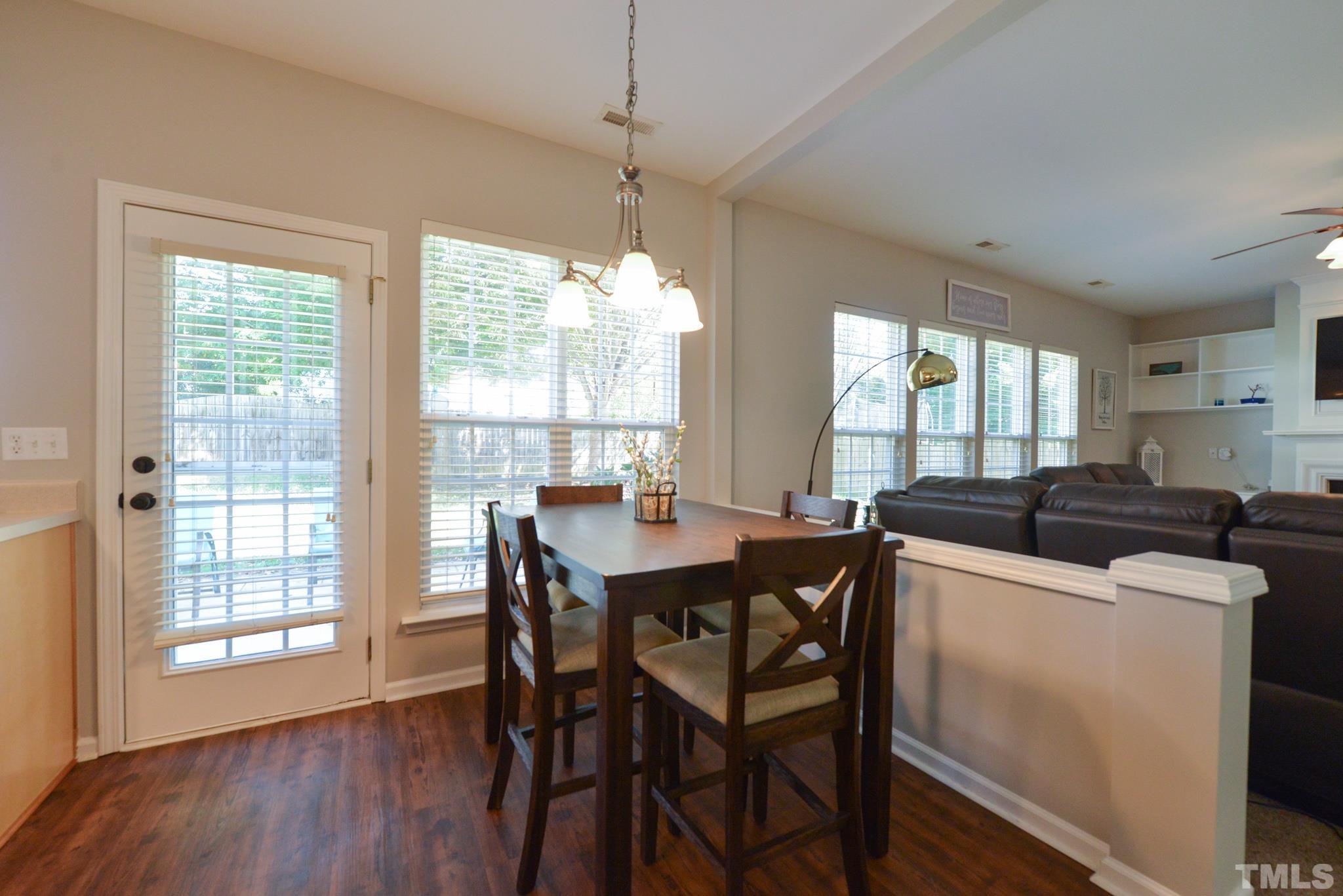 1513 Nealstone Way Raleigh, NC 27614 - Photo 12 of 30 a view of a dining room with furniture window and wooden floor