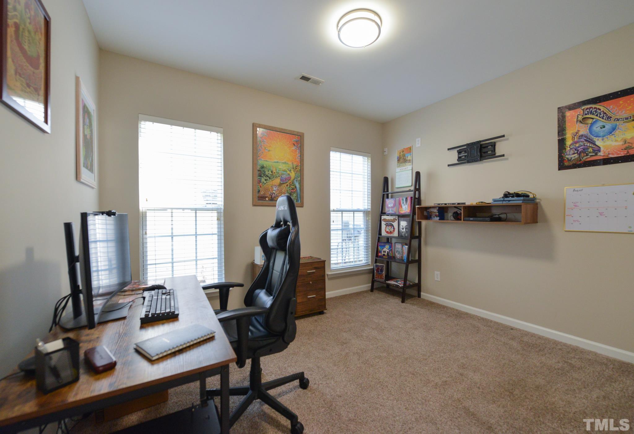 1513 Nealstone Way Raleigh, NC 27614 - Photo 17 of 30 a view of a workspace with furniture and a window