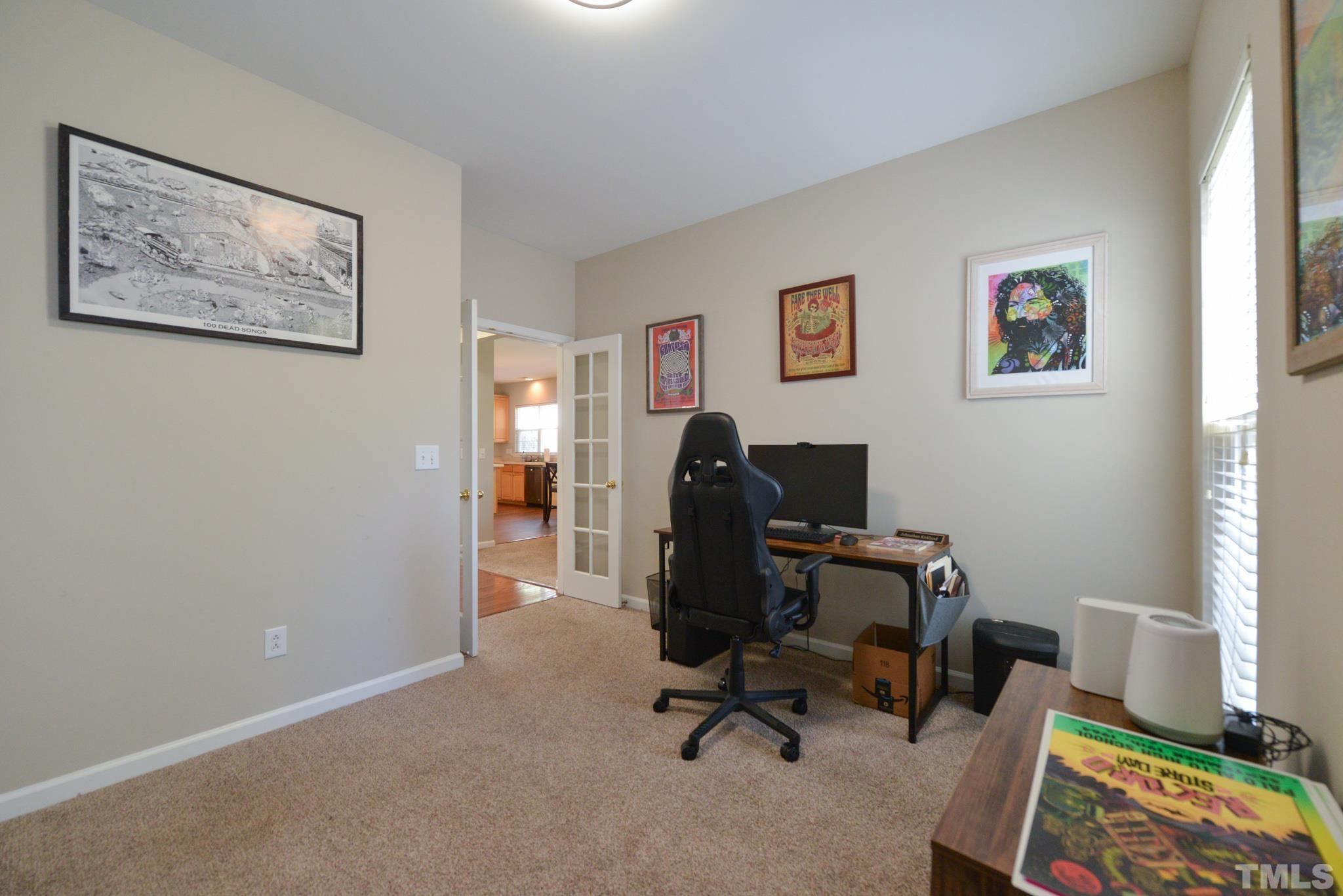 1513 Nealstone Way Raleigh, NC 27614 - Photo 18 of 30 a view of a workspace with furniture and a window