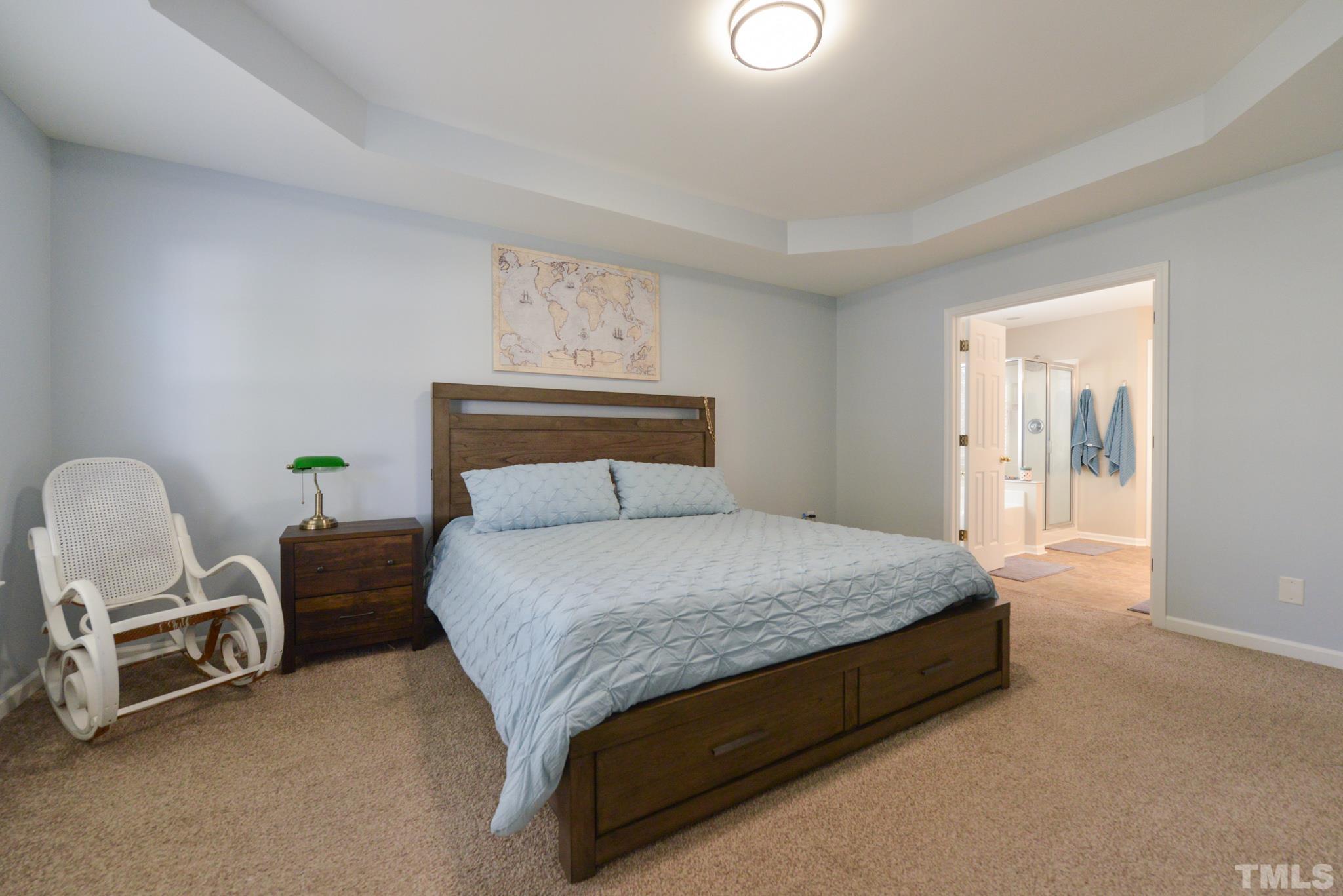 1513 Nealstone Way Raleigh, NC 27614 - Photo 20 of 30 a bedroom with a bed chair and window
