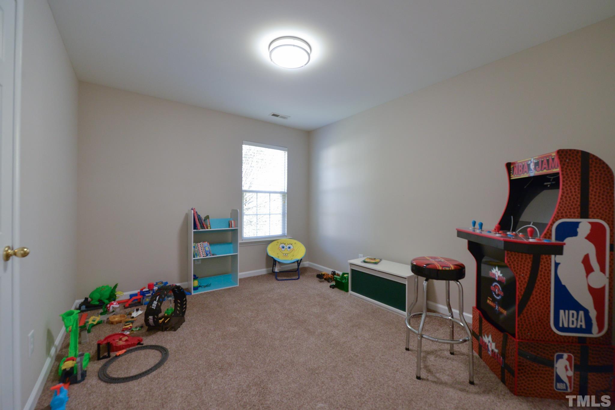 1513 Nealstone Way Raleigh, NC 27614 - Photo 27 of 30 a living room with furniture and a window