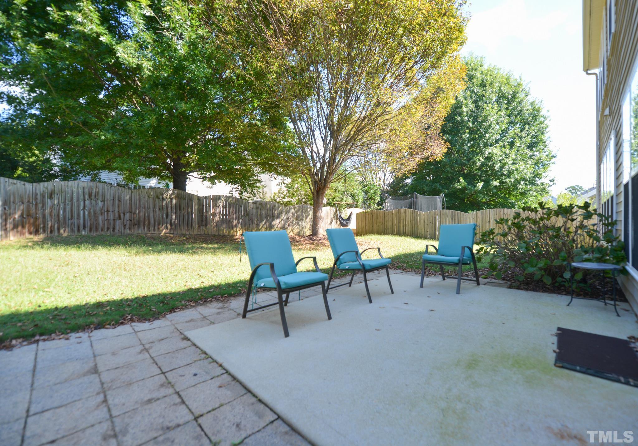 1513 Nealstone Way Raleigh, NC 27614 - Photo 28 of 30 a view of a chairs and table in backyard
