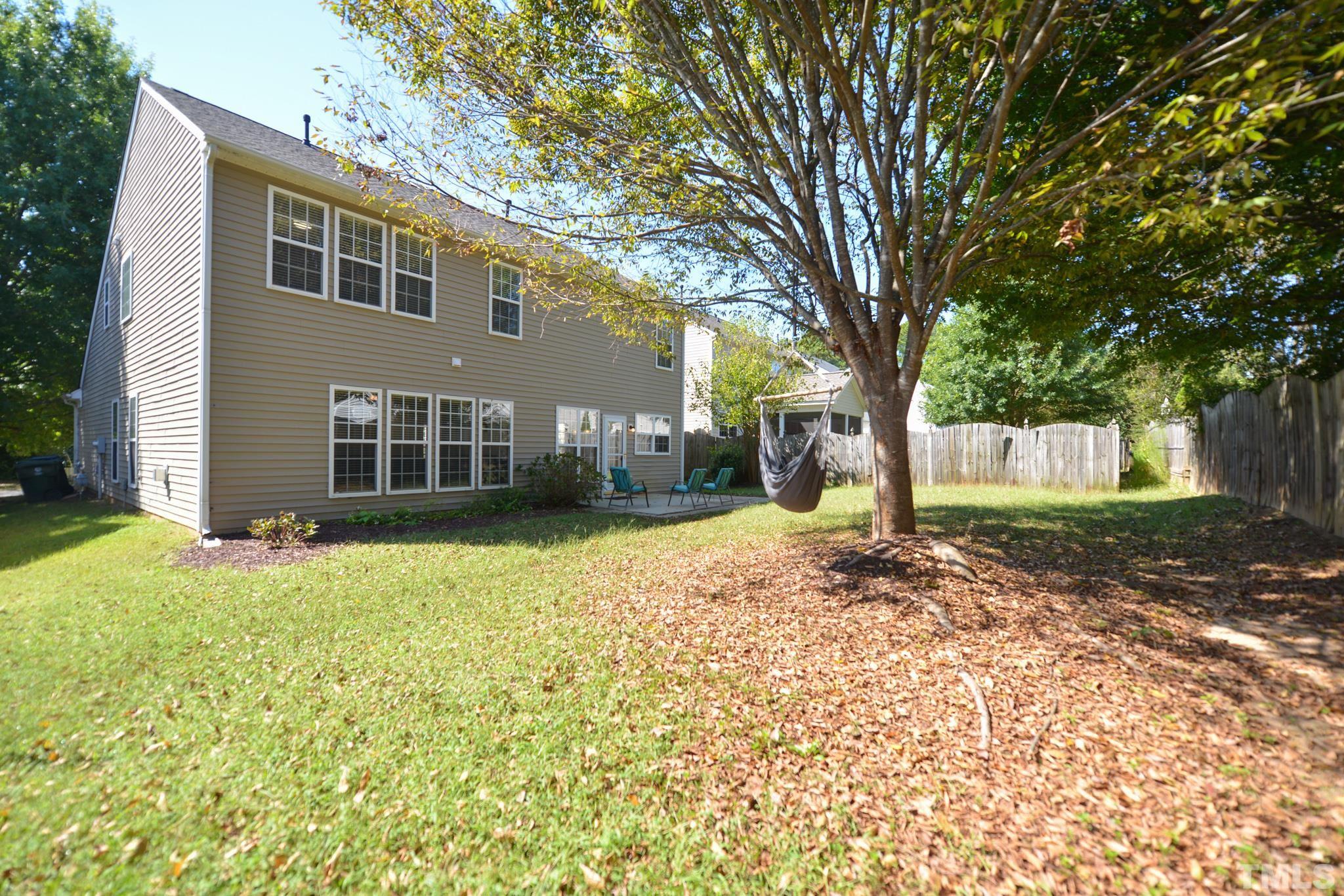 1513 Nealstone Way Raleigh, NC 27614 - Photo 30 of 30 a backyard of a house with oven and outdoor seating