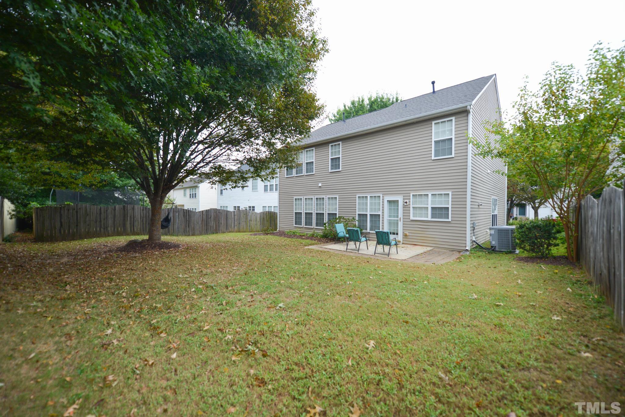 1513 Nealstone Way Raleigh, NC 27614 - Photo 4 of 30 a view of a house with backyard and a tree