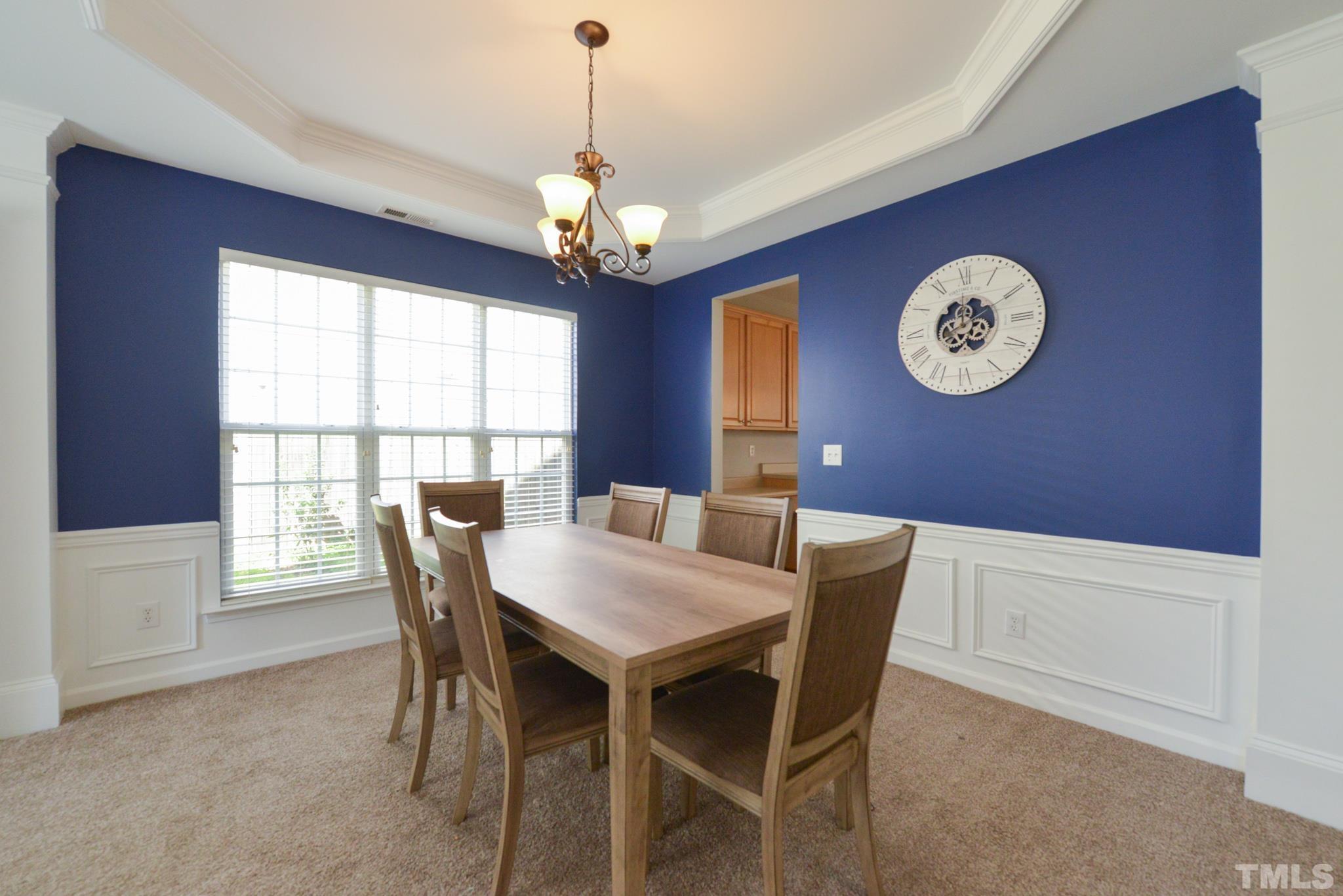 1513 Nealstone Way Raleigh, NC 27614 - Photo 6 of 30 a view of a dining room with furniture window and wooden floor