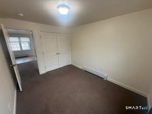 an empty room with a hallway