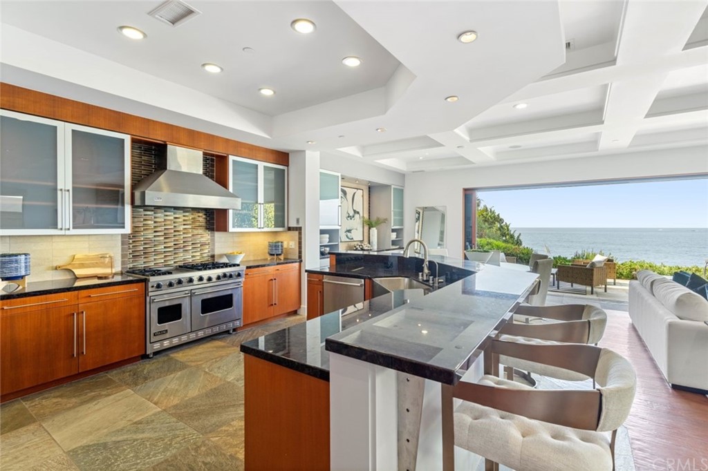 11 Camel Point Drive Laguna Beach, CA 92651 - Photo 11 of 67 a kitchen with stainless steel appliances granite countertop a stove and a sink