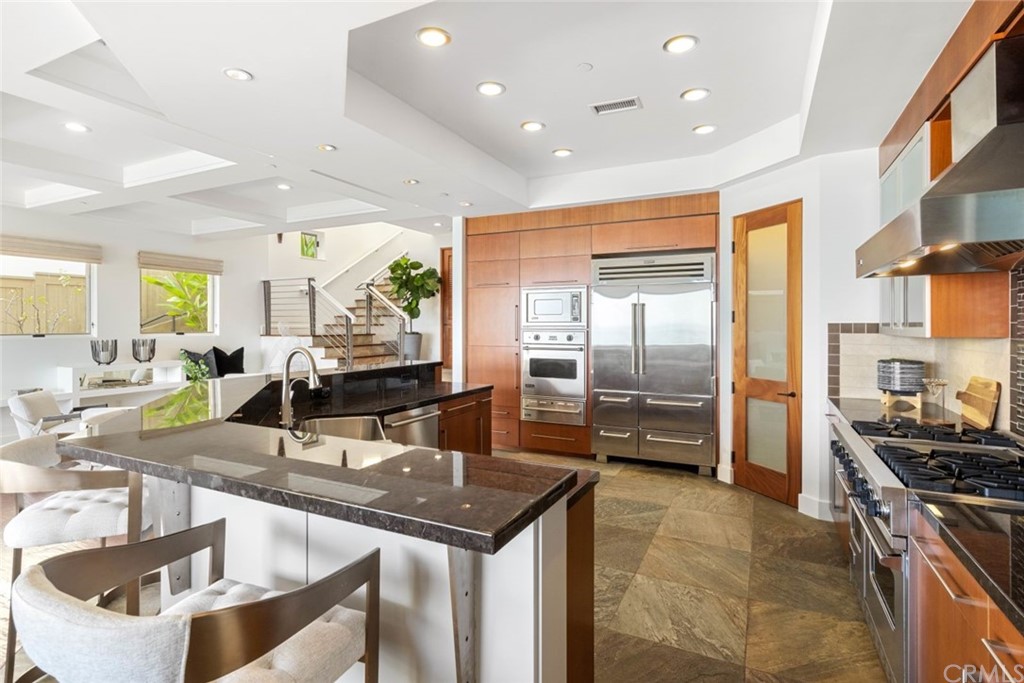11 Camel Point Drive Laguna Beach, CA 92651 - Photo 12 of 67 a kitchen with stainless steel appliances granite countertop a sink and a refrigerator