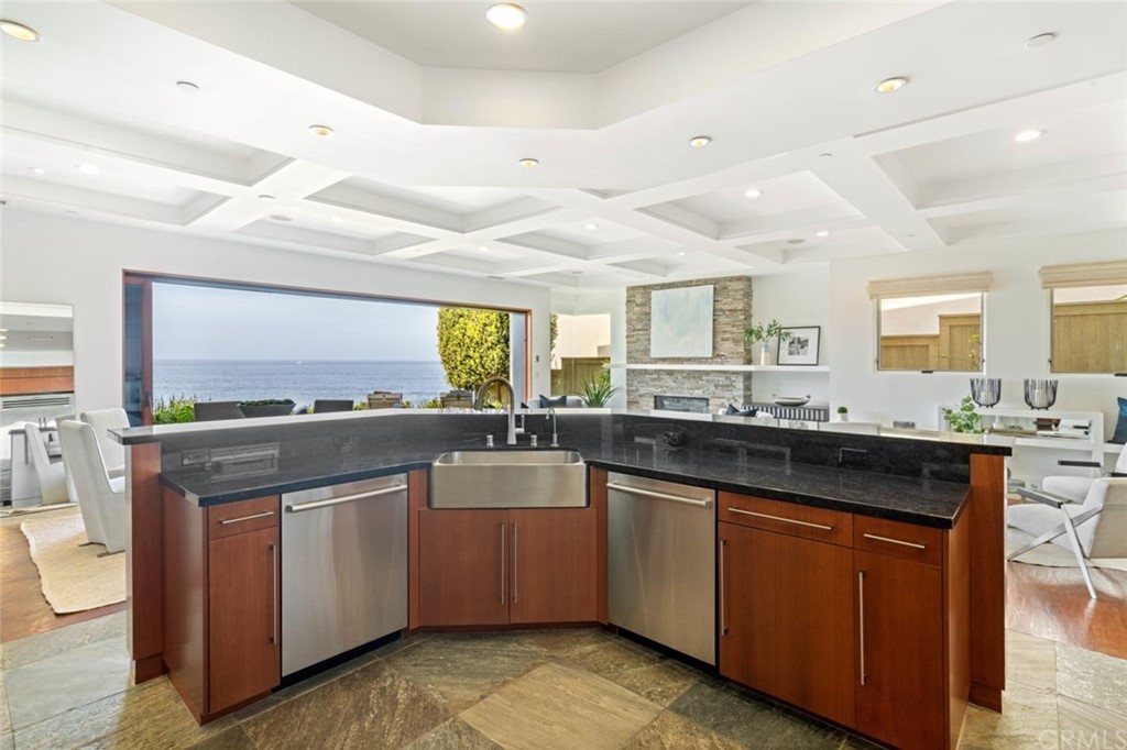 11 Camel Point Drive Laguna Beach, CA 92651 - Photo 13 of 67 a kitchen with a sink stove and cabinets