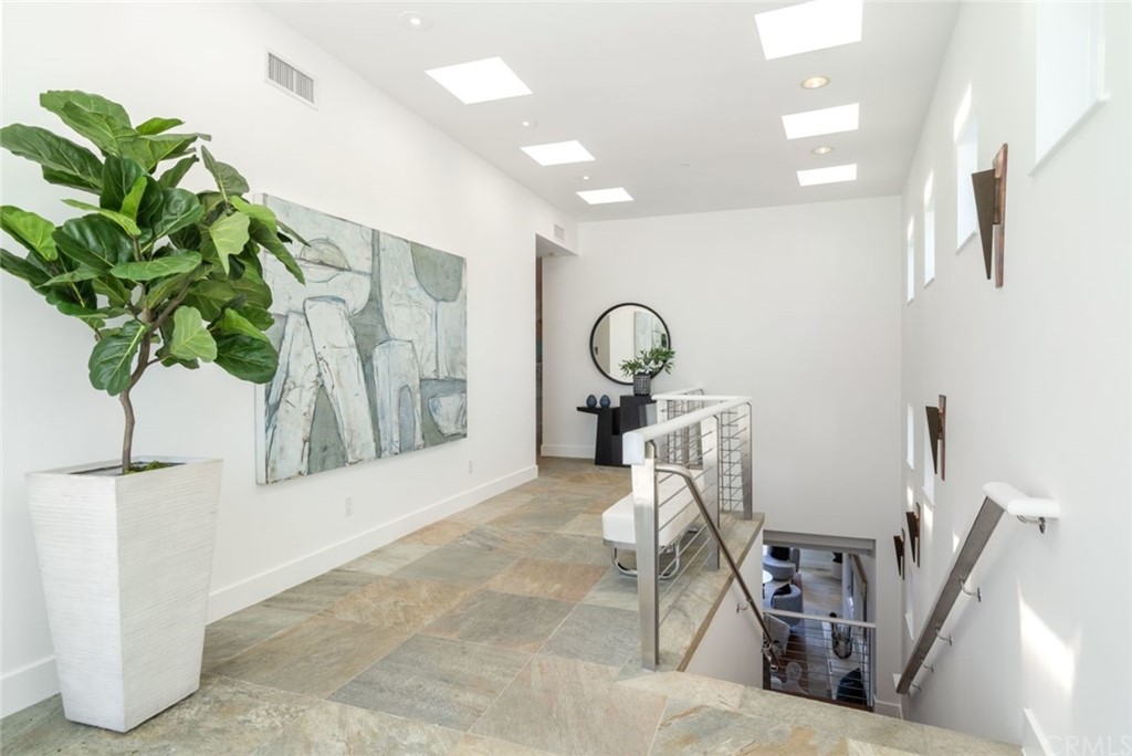 11 Camel Point Drive Laguna Beach, CA 92651 - Photo 15 of 67 a living room with furniture and a potted plant