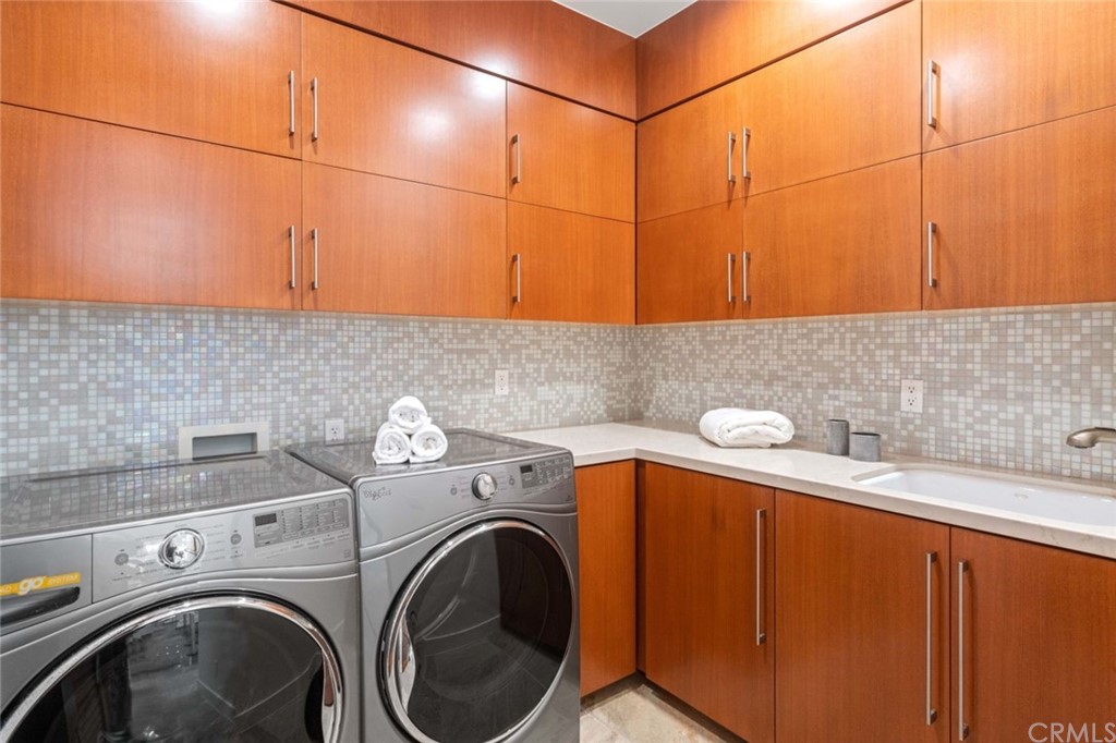 11 Camel Point Drive Laguna Beach, CA 92651 - Photo 35 of 67 a utility room with dryer and washer