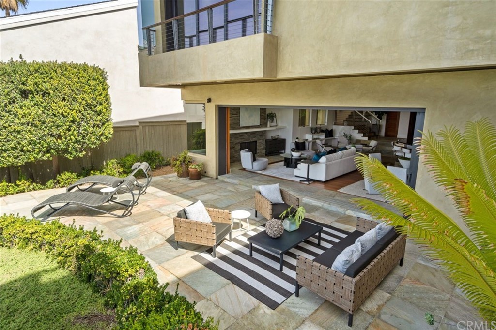 11 Camel Point Drive Laguna Beach, CA 92651 - Photo 36 of 67 a view of a patio with table and chairs and potted plants