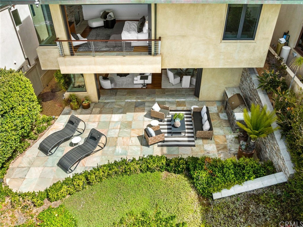 11 Camel Point Drive Laguna Beach, CA 92651 - Photo 41 of 67 a picture of a table and chairs in the patio