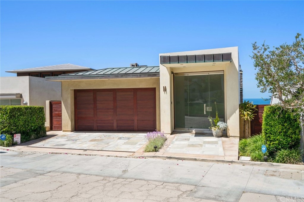 11 Camel Point Drive Laguna Beach, CA 92651 - Photo 59 of 67 a front view of a house with a yard