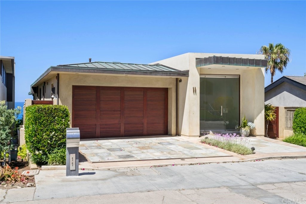 11 Camel Point Drive Laguna Beach, CA 92651 - Photo 60 of 67 a front view of a house with a garage