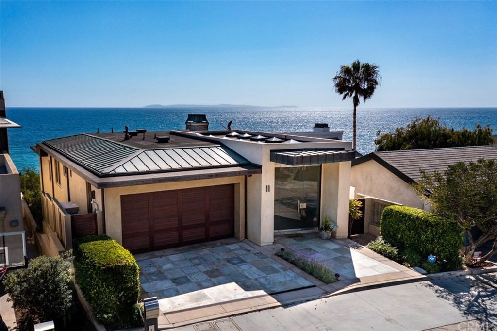 11 Camel Point Drive Laguna Beach, CA 92651 - Photo 61 of 67 a front view of a house with a yard