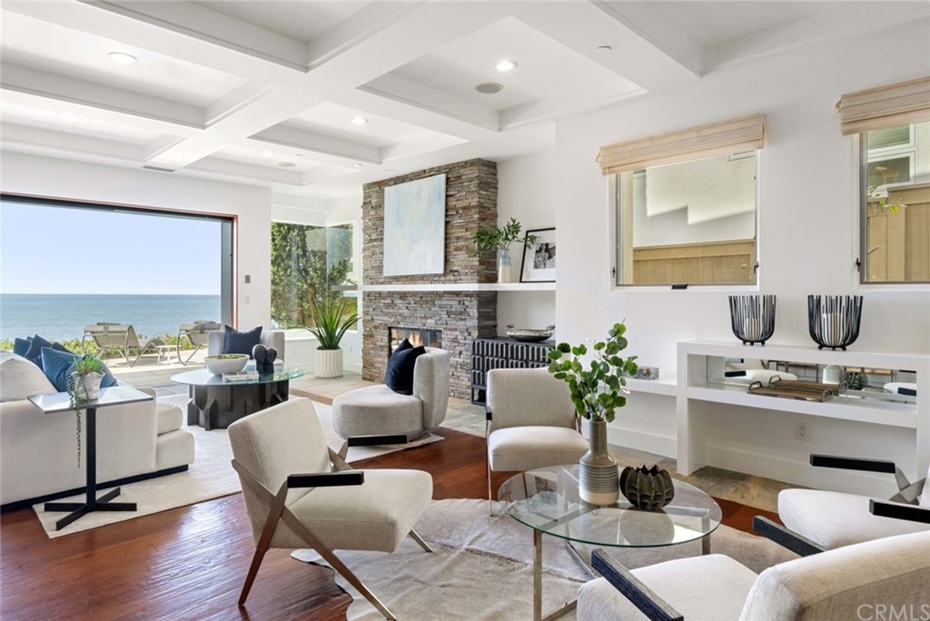11 Camel Point Drive Laguna Beach, CA 92651 - Photo 8 of 67 a living room with fireplace furniture and a large window