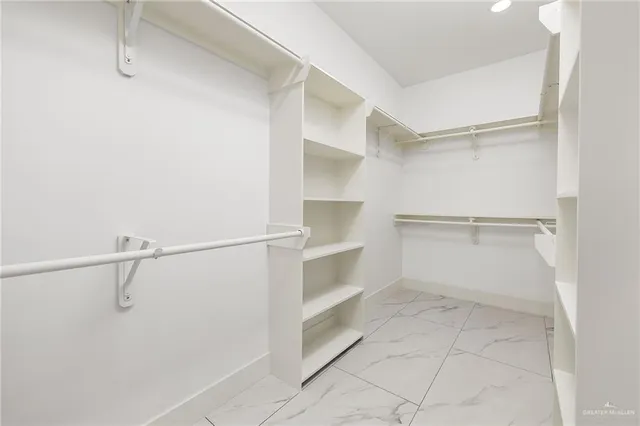 a view of an empty walk in closet