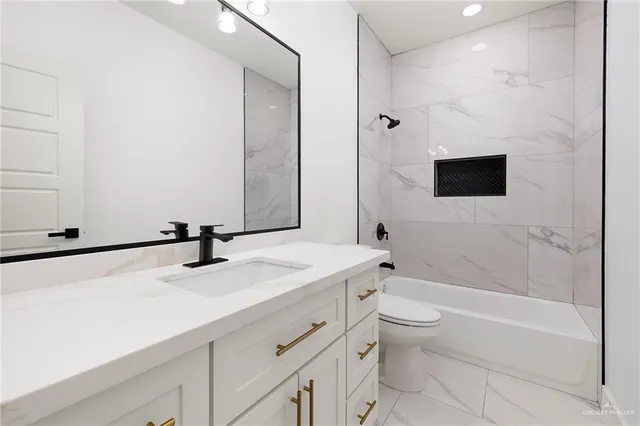 a bathroom with a sink a toilet and a bathtub