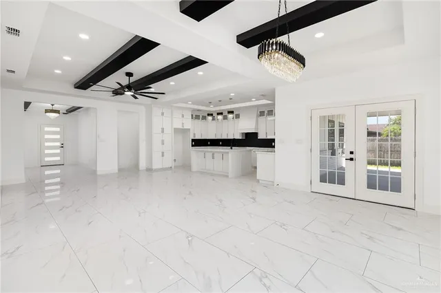 a view of a kitchen with a sink and a refrigerator