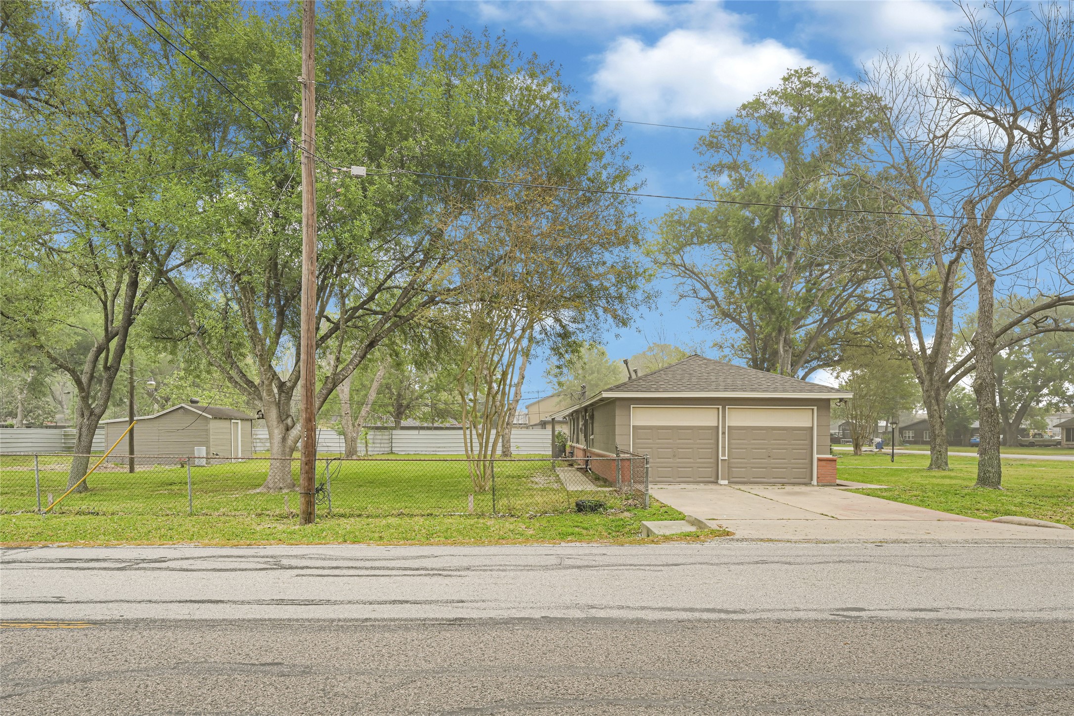 205 Grammar Road Houston, TX 77047 - Photo 20 of 26 a view of a house with a garden and trees