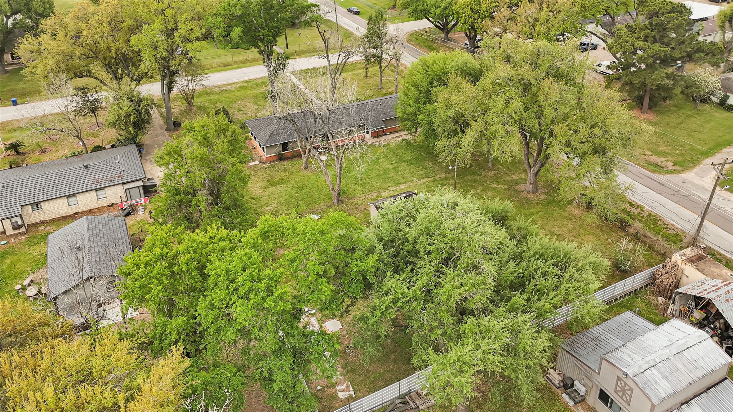 205 Grammar Road Houston, TX 77047 - Photo 23 of 26 an aerial view of residential house with outdoor space and trees all around