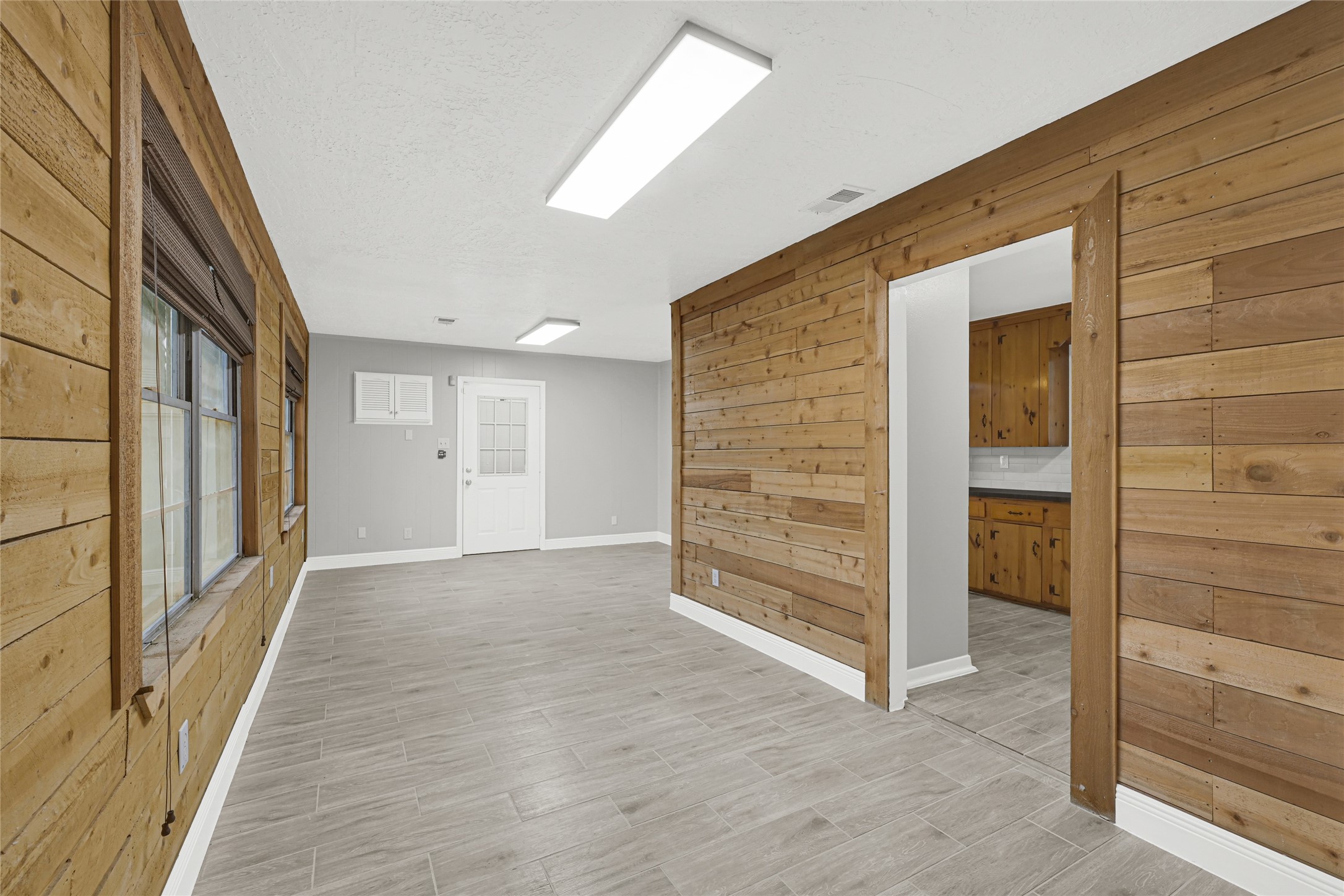 205 Grammar Road Houston, TX 77047 - Photo 5 of 26 wooden floor in an empty room