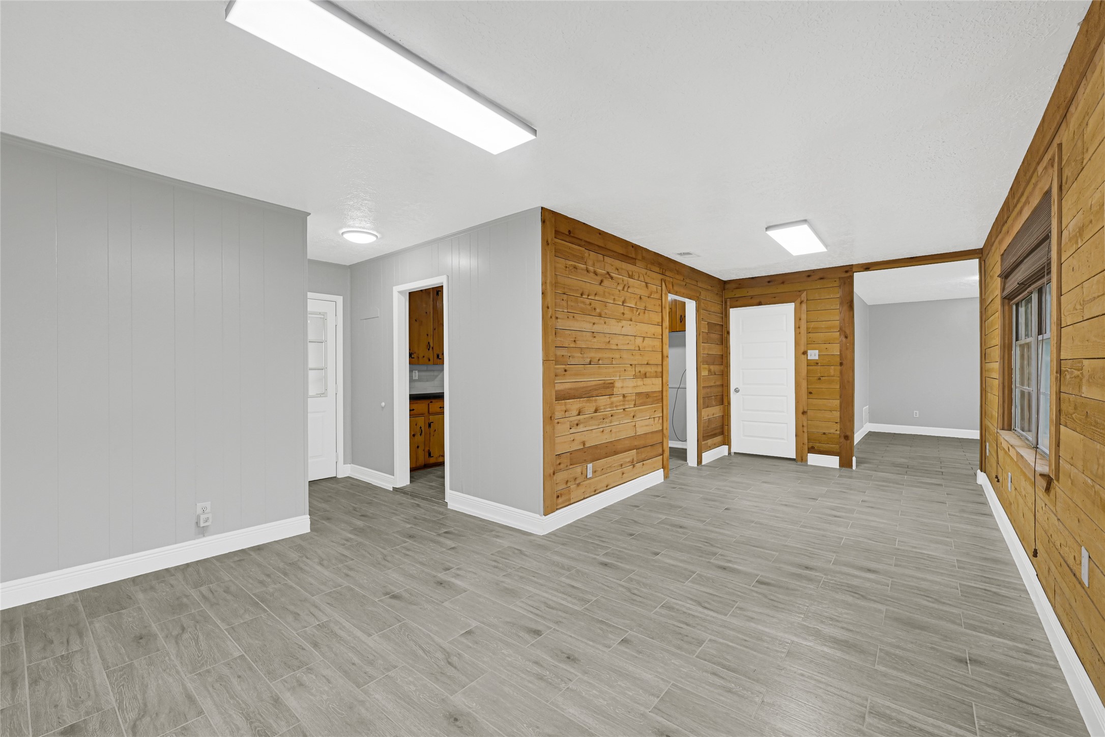 205 Grammar Road Houston, TX 77047 - Photo 6 of 26 an empty room with wooden floor and closet