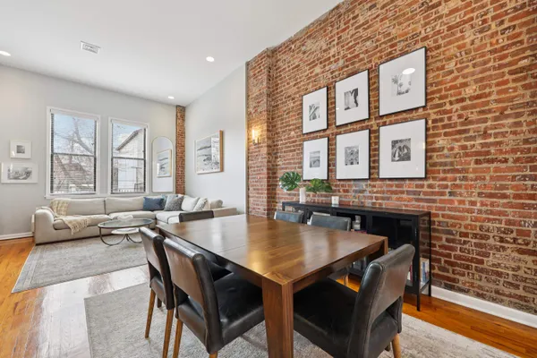a dining room with furniture and window