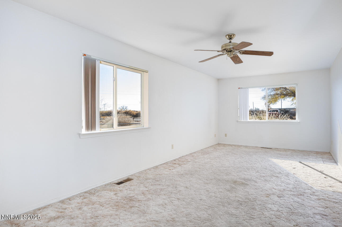 120 Hunter Park Way Fallon, NV 89406 - Photo 7 of 27 a view of an empty room with a window