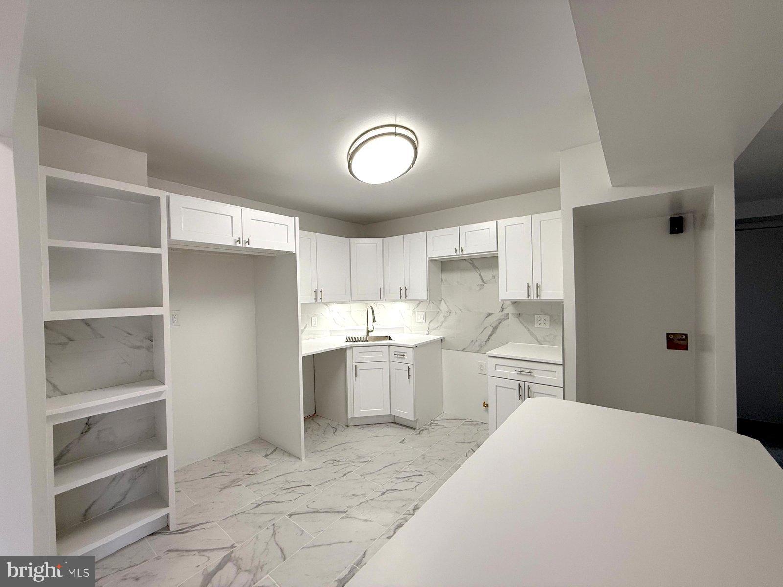 606 Cooper Landing Road, Unit A3K Cherry Hill, NJ 08002 - Photo 5 of 17 a kitchen with a refrigerator and a stove top oven