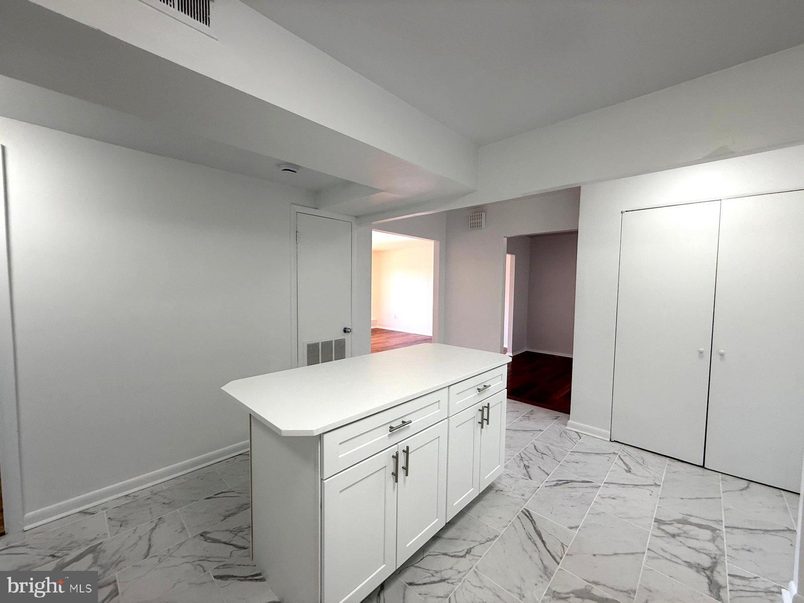 606 Cooper Landing Road, Unit A3K Cherry Hill, NJ 08002 - Photo 8 of 18 a utility room with cabinets washer and dryer