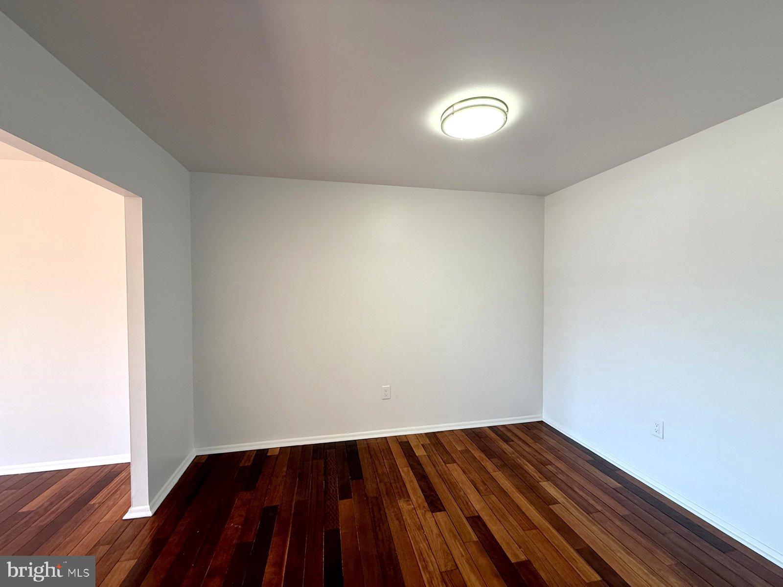 606 Cooper Landing Road, Unit A3K Cherry Hill, NJ 08002 - Photo 9 of 17 a view of an empty room and wooden floor