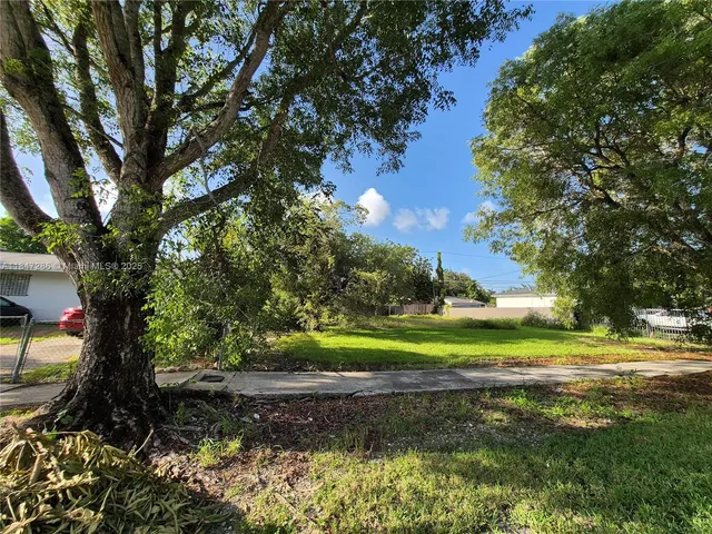 a view of a golf course with a park
