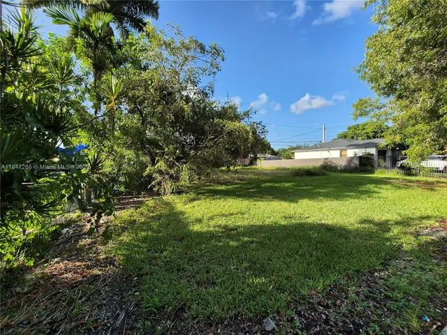 a view of a golf course with a yard