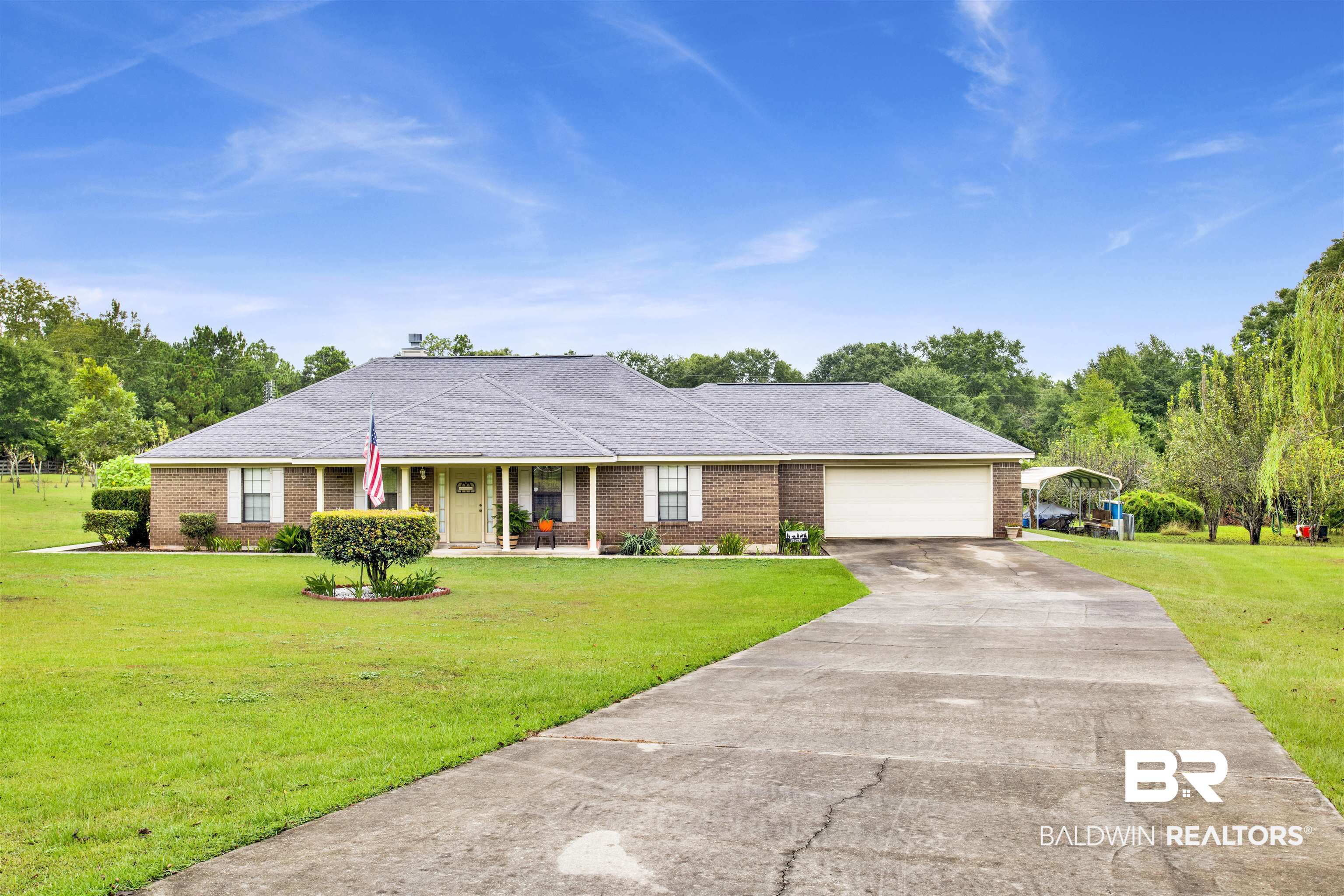 54563 Splinter Hill Road Perdido, AL 36562 - Photo 4 of 29 Single story home featuring a front lawn, a garage, and a porch