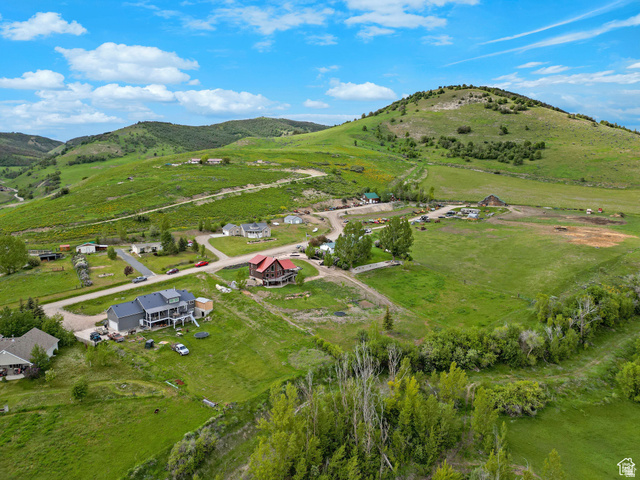 306 Spring Road Preston, ID 83263 - Photo 3 of 55 Expansive green landscape with rolling hills and distant mountains