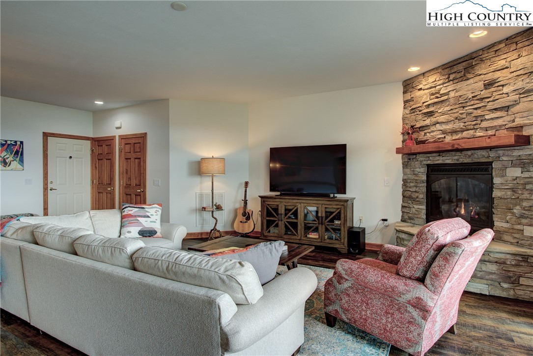 202 Pleasant View, Unit 9D Sugar Mountain, NC 28604 - Photo 14 of 48 a living room with furniture and a flat screen tv